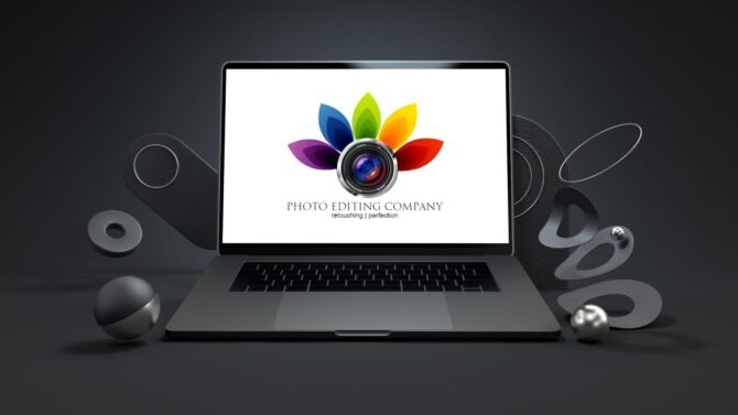 Laptop With Photo Editing Company Logo